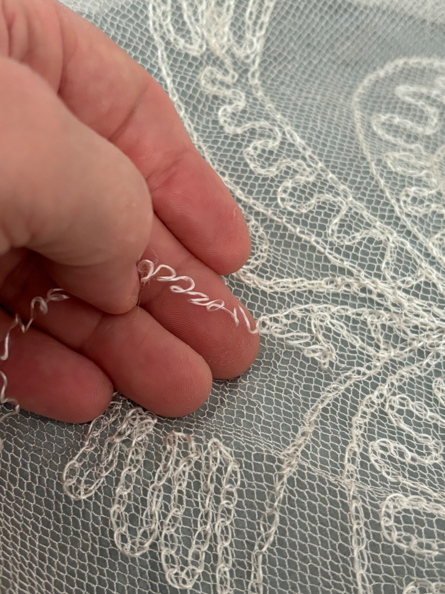 Hand-sewn lace detail on an heirloom wedding veil restored by Alterations by Jacqui, Shoalhaven Heads