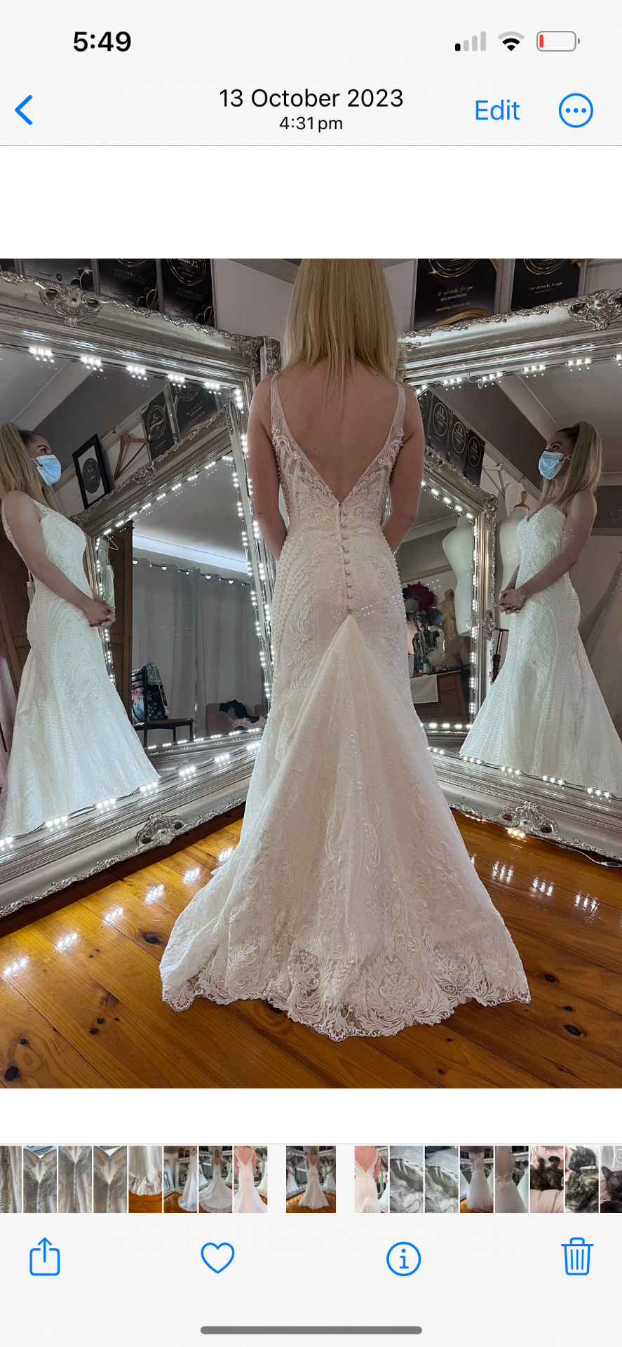 Lace fit-and-flare wedding gown with deep V back and covered buttons after bridal alterations by Jacqui