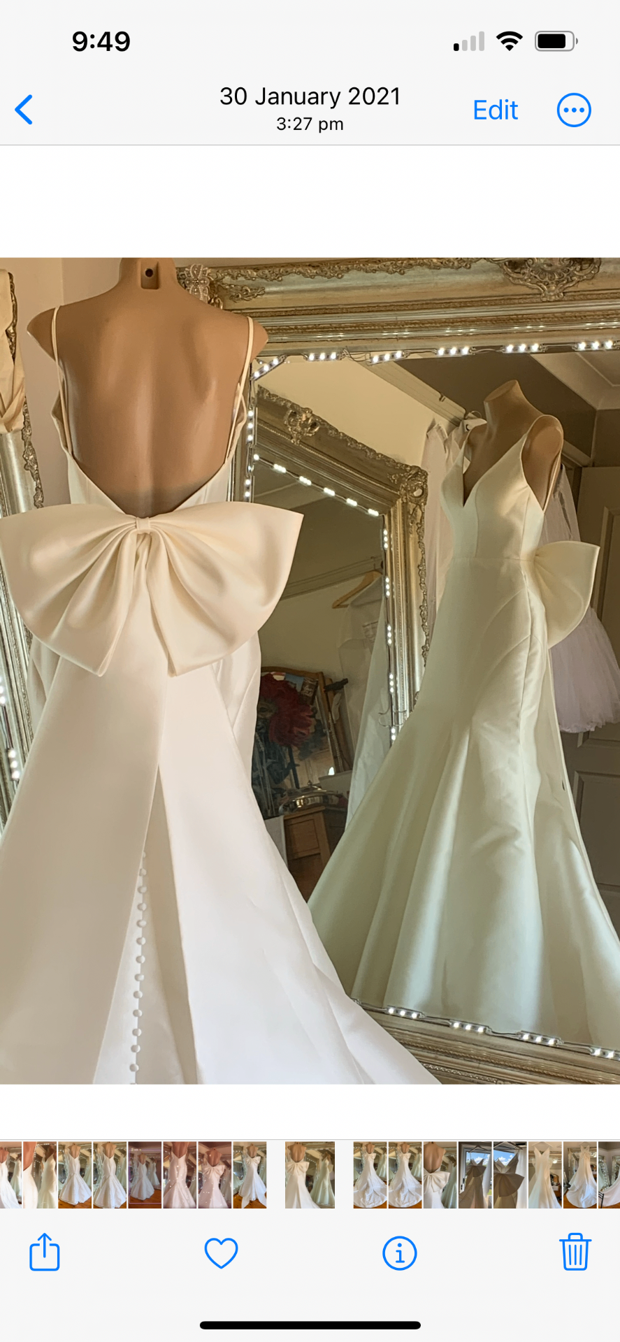 Fitted satin wedding gown with oversized back bow and covered-button train reworked by Alterations by Jacqui