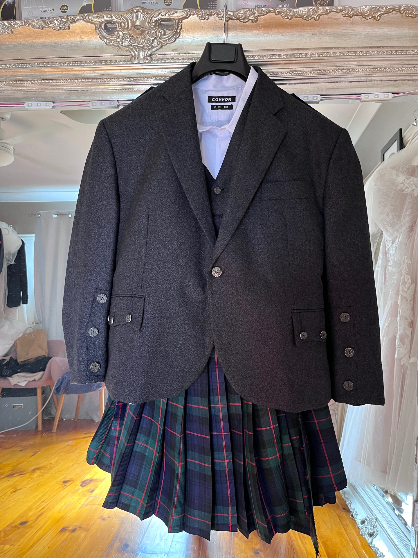 Charcoal wool jacket and waistcoat over a tartan kilt hanging in Jacqui's studio — kilt outfit and jacket alterations by Jacqui, NSW South Coast