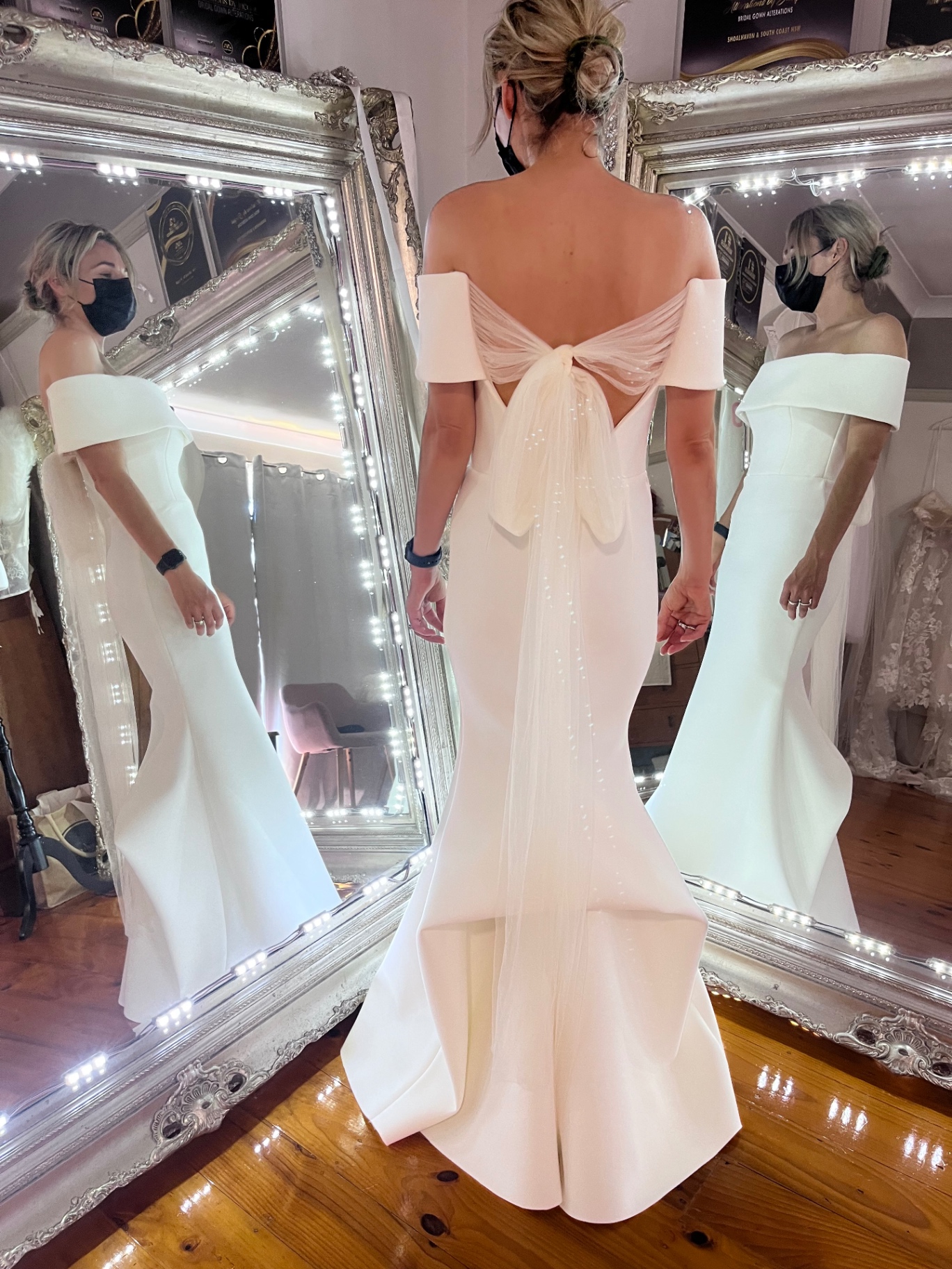 Off-shoulder crepe mermaid wedding gown with tulle bow back detail altered by Alterations by Jacqui
