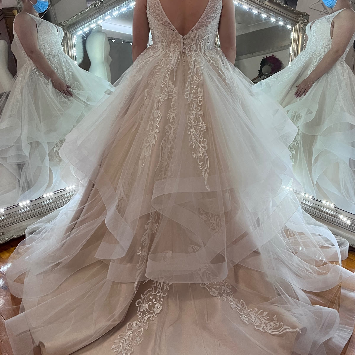 Tiered tulle wedding gown with lace train fitted at Jacqui's bridal alterations studio, NSW South Coast