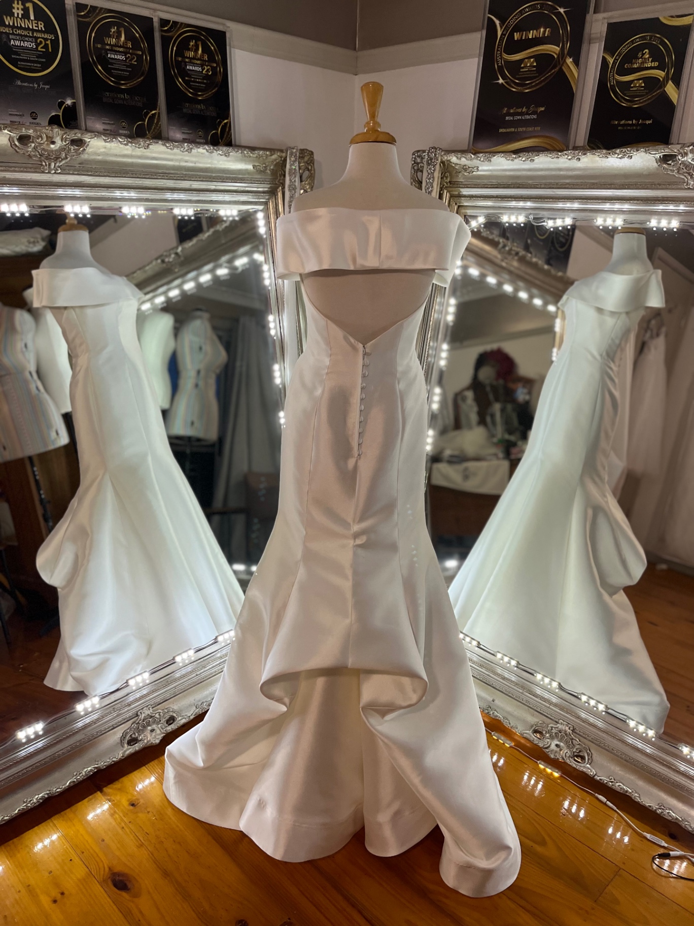 Off-shoulder satin mermaid wedding gown with sculpted train fitted at Jacqui's bridal studio, NSW