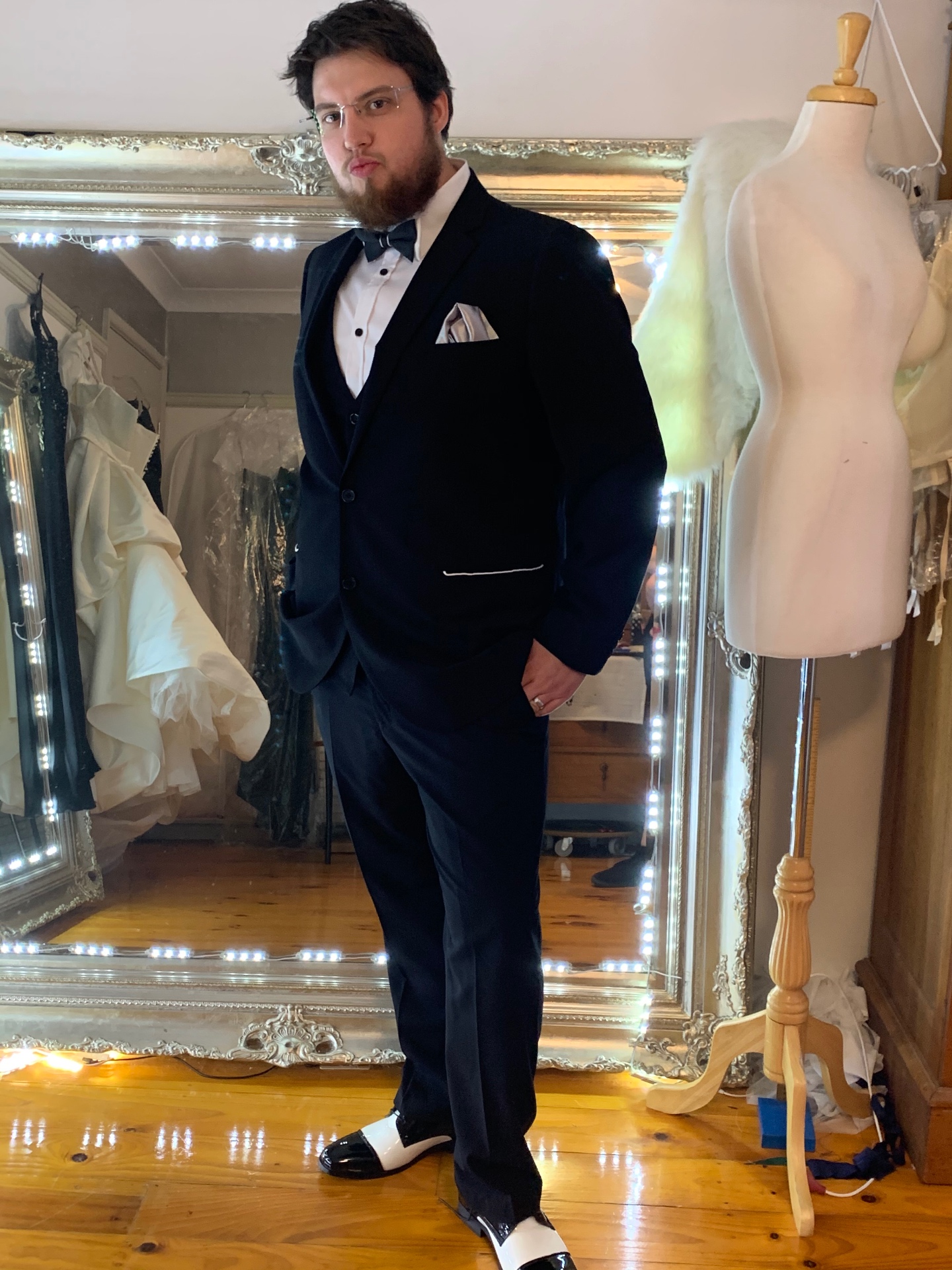 Groom in a tailored navy three-piece tuxedo with black bow tie and pocket square — suit fitting and formalwear alterations by Jacqui, Shoalhaven Heads