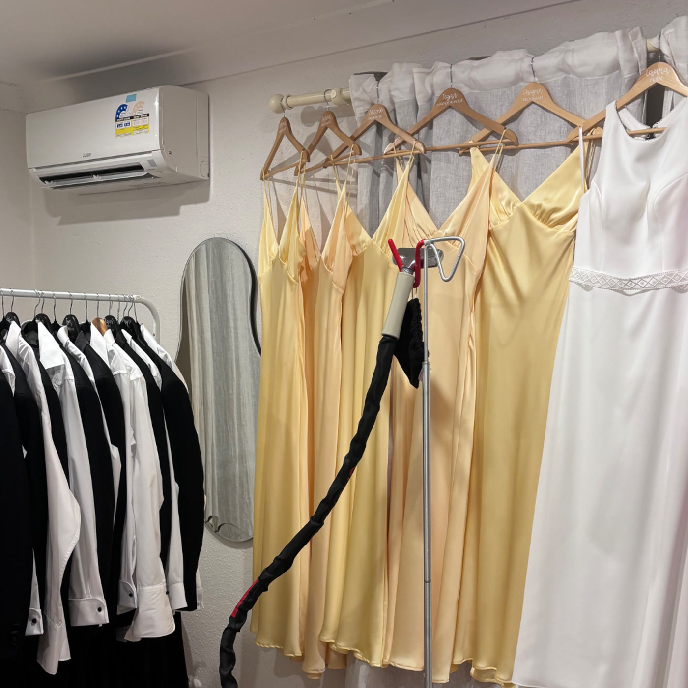On-site wedding steaming setup with dresses, suits and professional steamer — Shoalhaven Heads NSW