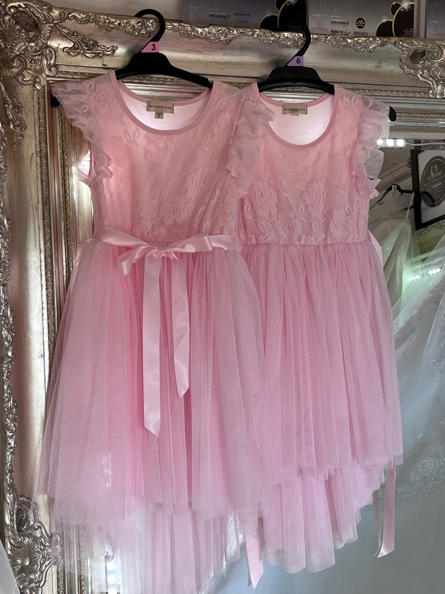 Matching pink lace bodice and tulle skirt flower girl dresses with satin sashes